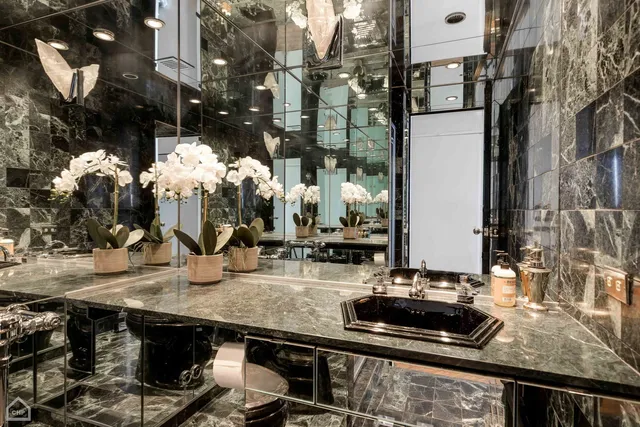 a kitchen counter top with stove and cabinets