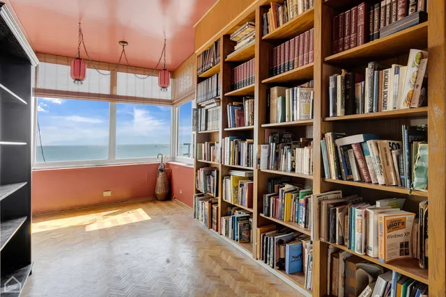 a living room with lots of books