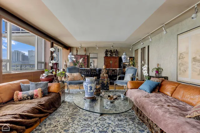 a living room with furniture and a large window