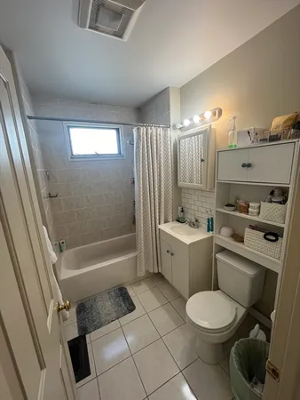 a bathroom with a bathtub toilet and sink