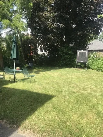 a backyard of a house with lots of green space