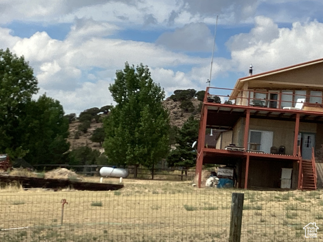 View of yard with a wooden deck