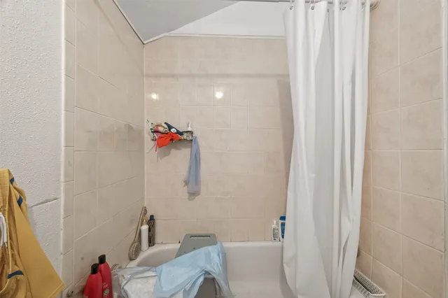 a bathroom with a sink and a shower