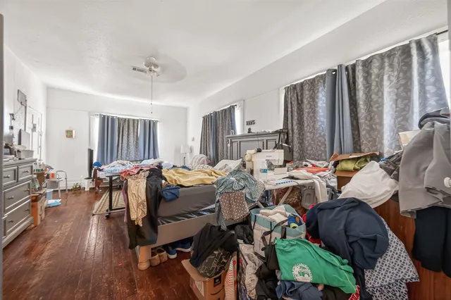 a bed room with a bed and a chair