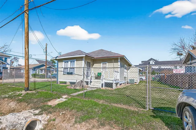 a view of a house with a yard porch and sitting area