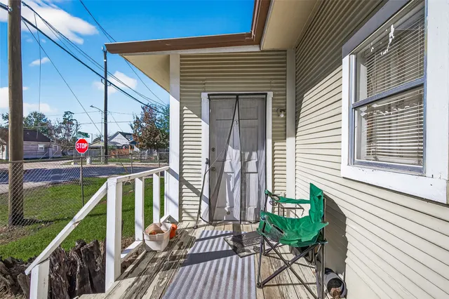 a view of a balcony with chairs