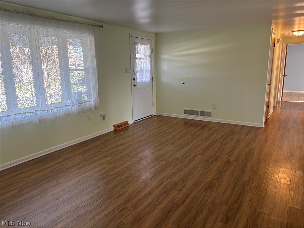 64197 Morrison Road Cambridge, OH 43725 - Photo 13 of 41 Empty room with dark hardwood / wood-style flooring