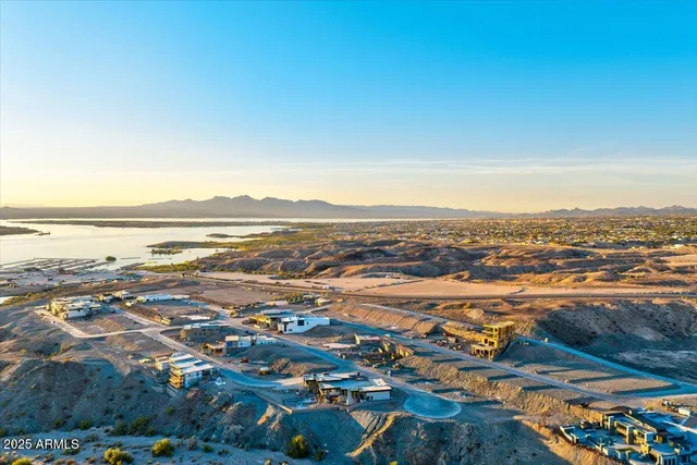 an aerial view of residential building and ocean view