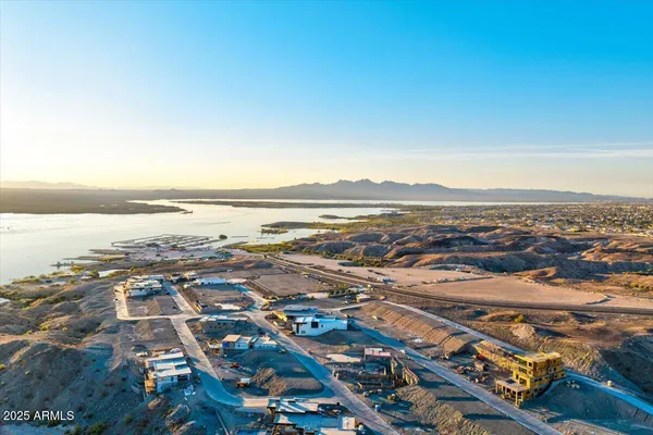 an aerial view of residential building and ocean
