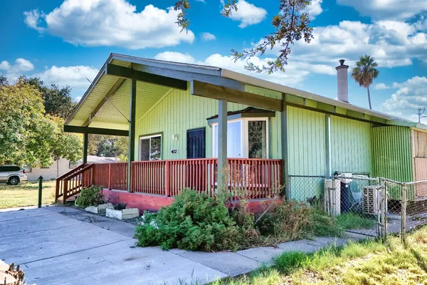 a view of a house with a flower garden