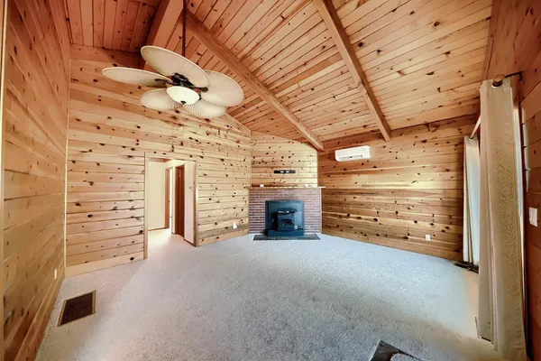 a view of a room with wooden walls