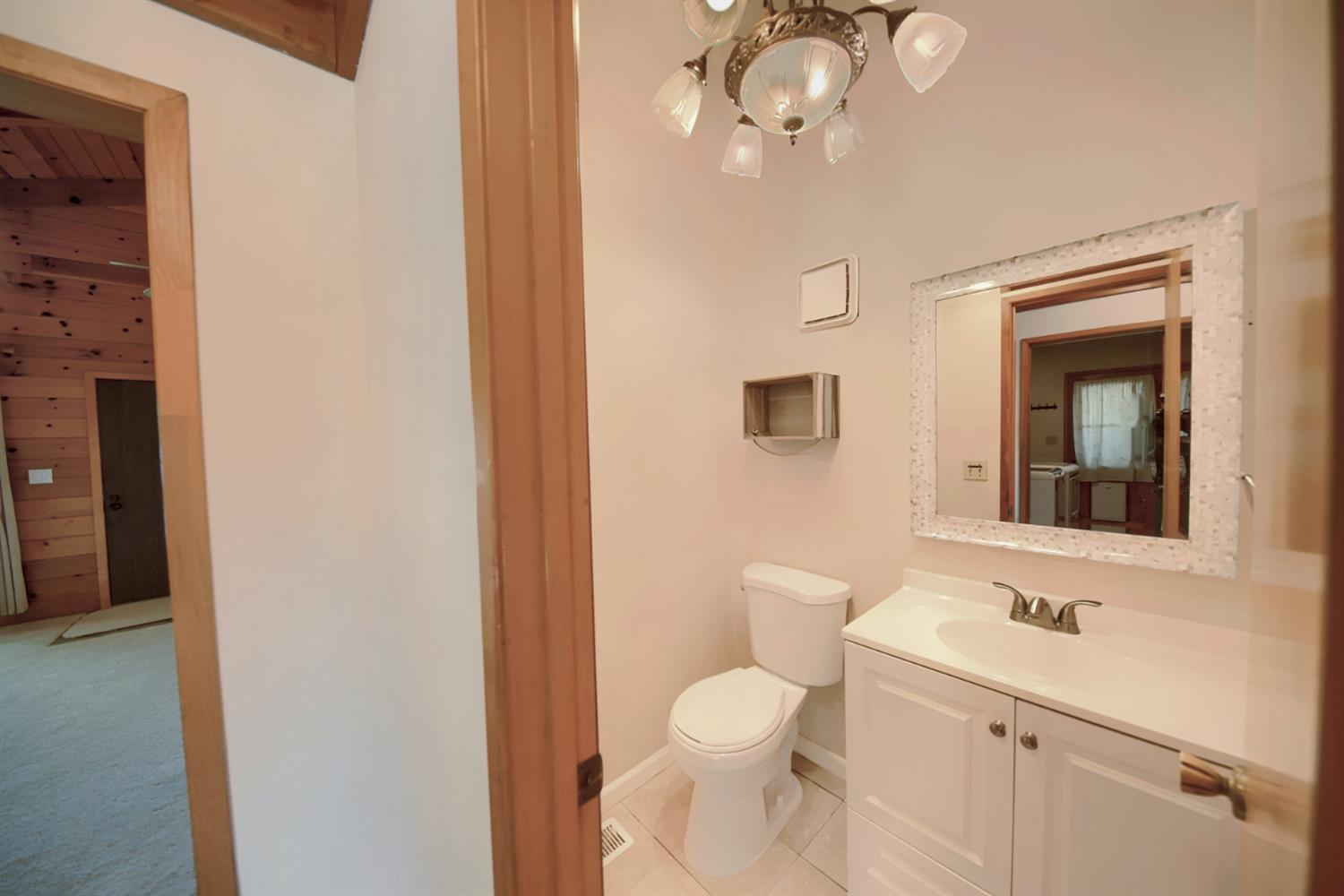 30000 Kasson Road Tracy, CA 95304 - Photo 45 of 71 a bathroom with a toilet a sink and mirror