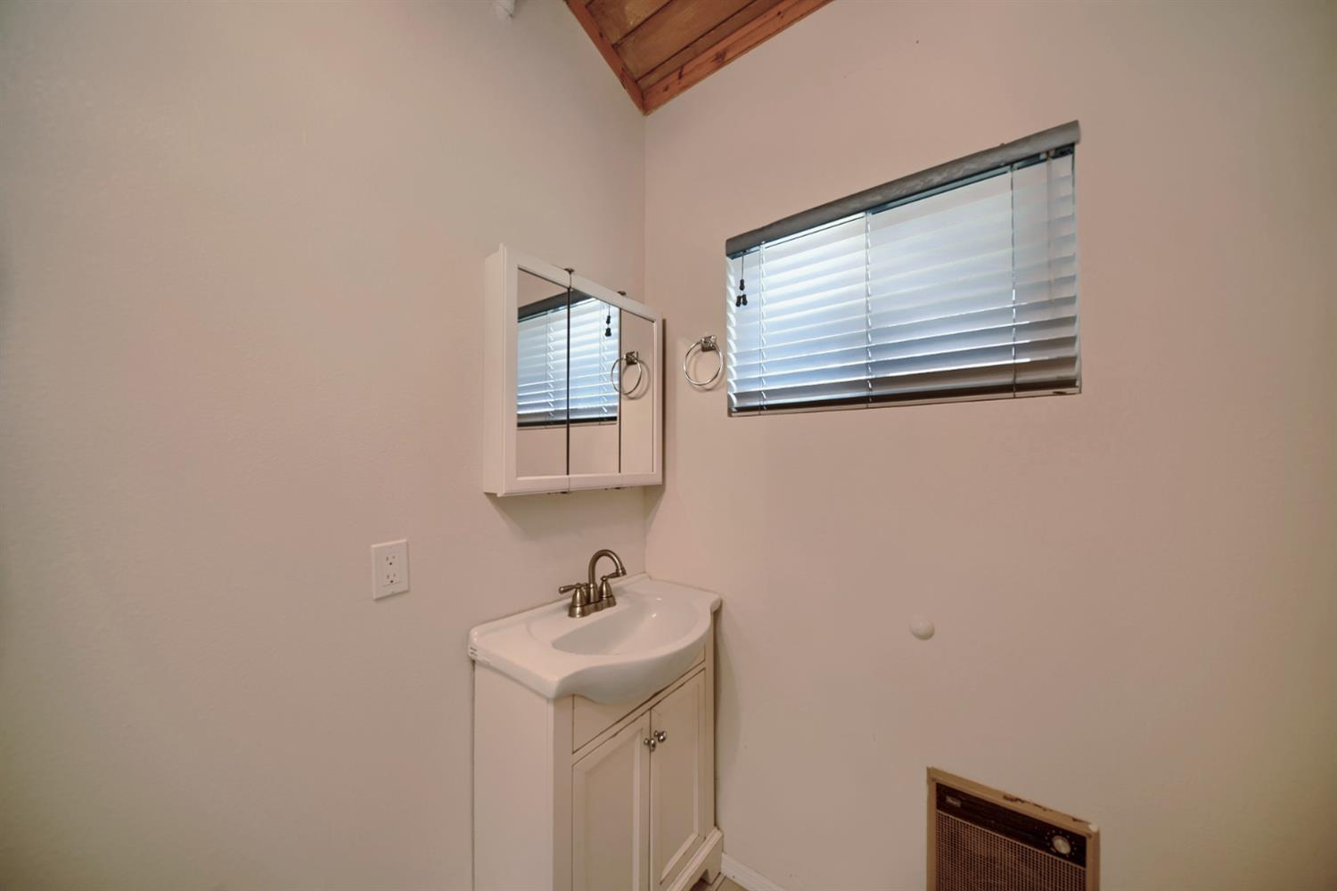 30000 Kasson Road Tracy, CA 95304 - Photo 57 of 71 a bathroom with a sink and a mirror