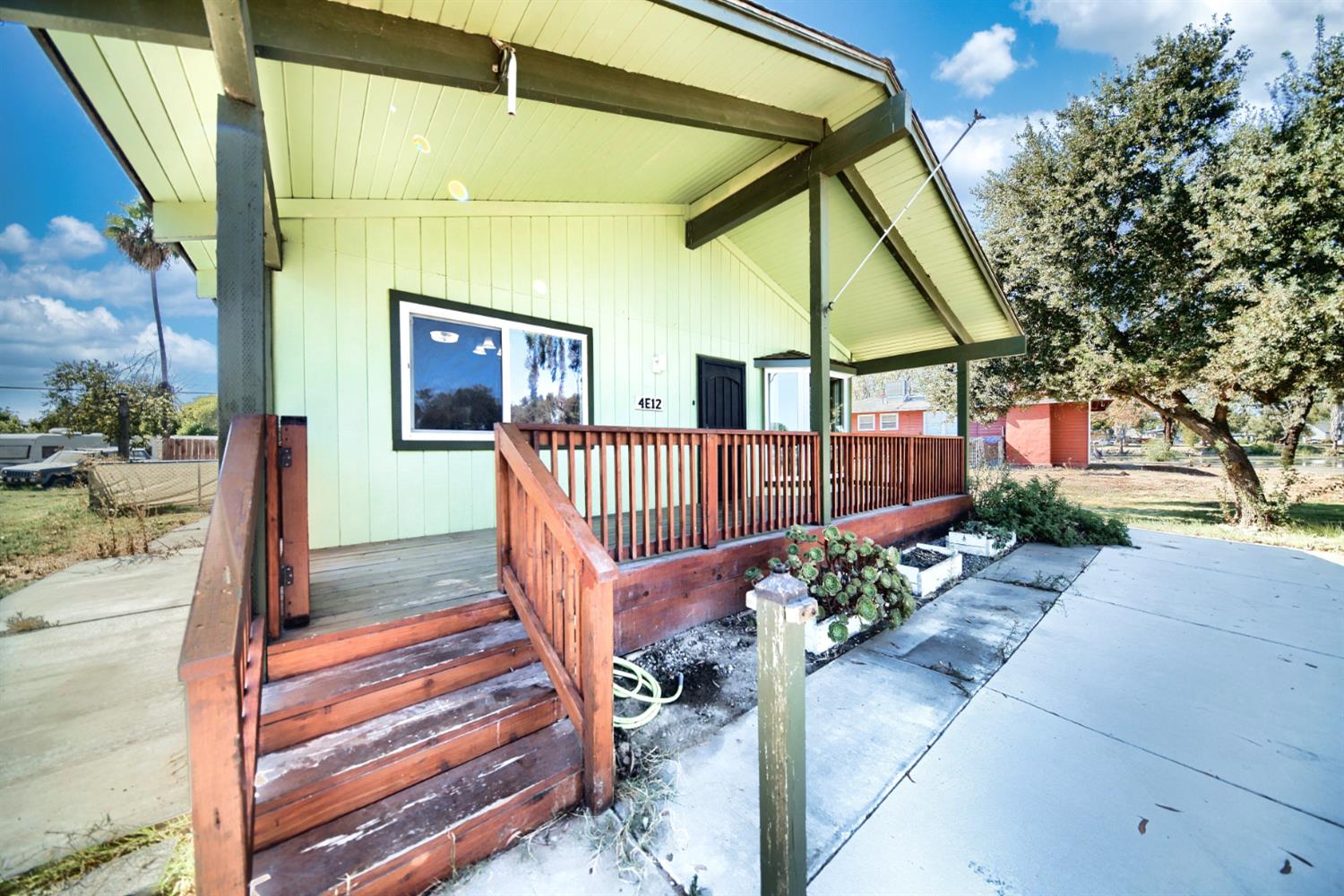30000 Kasson Road Tracy, CA 95304 - Photo 9 of 71 a view of a house with a flower garden