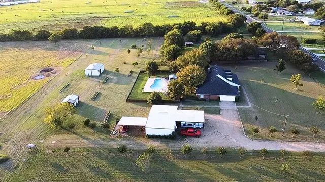 an aerial view of residential building with outdoor space and ocean