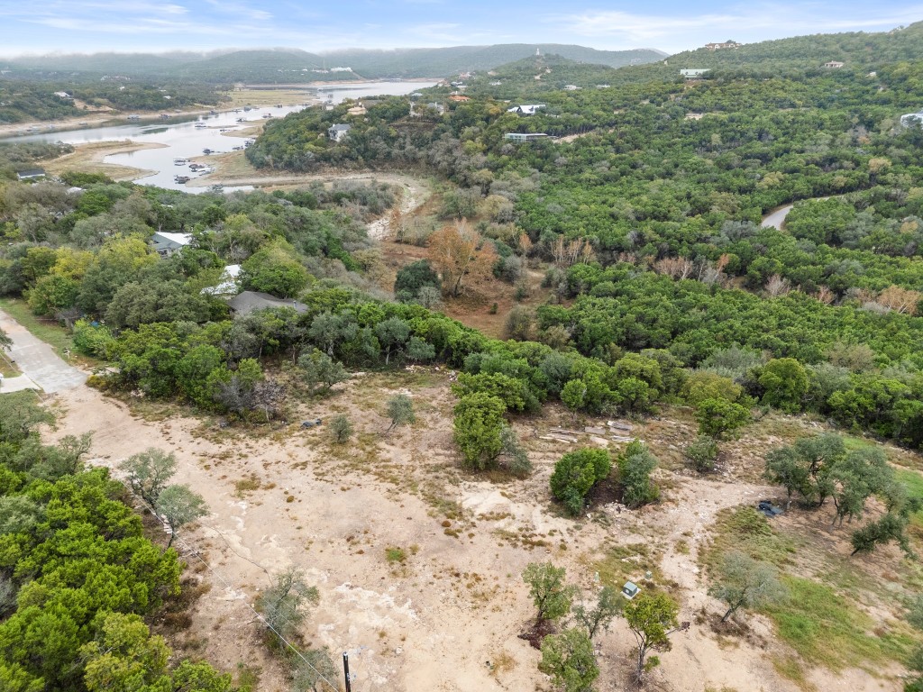 18211 Gregg Bluff Road Jonestown, TX 78645 - Photo 12 of 24 Drone / aerial view of a water and mountain view