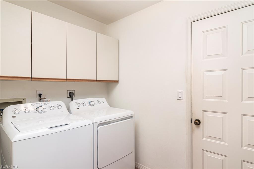 249 St James Way Naples, FL 34104 - Photo 16 of 23 a utility room with dryer and washer