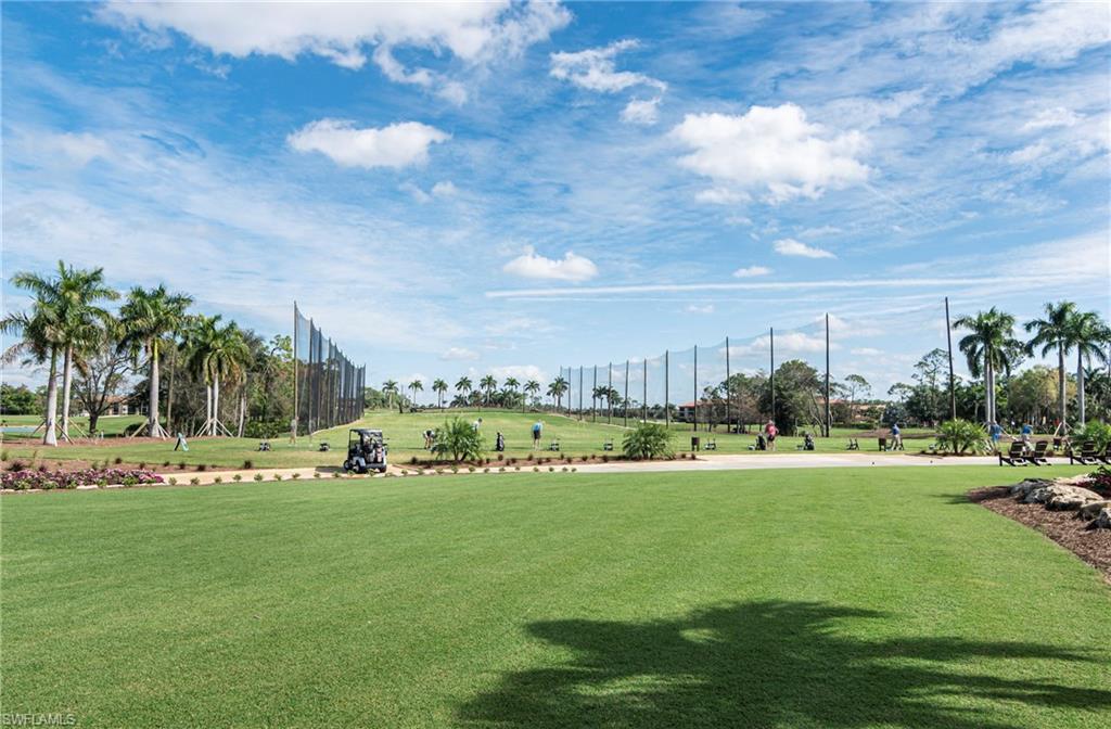 249 St James Way Naples, FL 34104 - Photo 22 of 23 a view of a golf course with green space