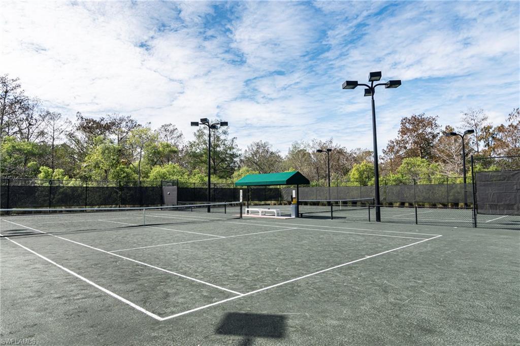 249 St James Way Naples, FL 34104 - Photo 23 of 23 a view of a tennis court