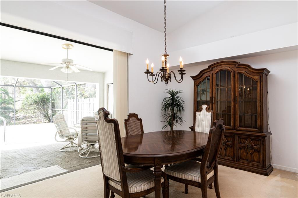 249 St James Way Naples, FL 34104 - Photo 5 of 23 a view of a dining room with furniture window and outside view