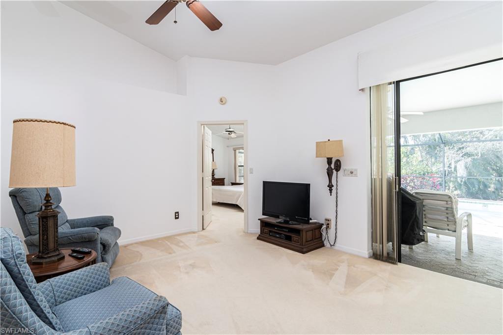 249 St James Way Naples, FL 34104 - Photo 6 of 23 a bedroom with furniture and a flat screen tv