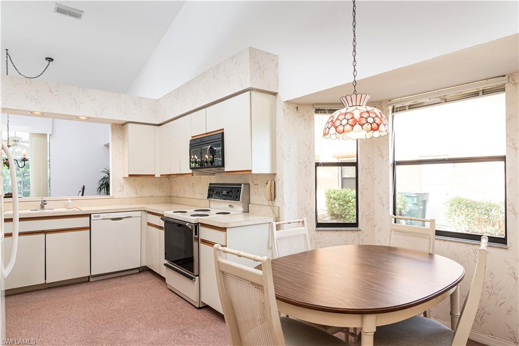 249 St James Way Naples, FL 34104 - Photo 8 of 23 a very nice looking dining room with a large window