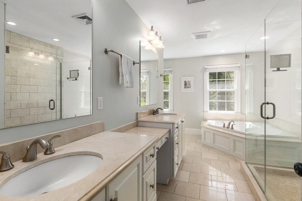 30 Pinecroft Road Weston, MA 02493 - Photo 19 of 38 a spacious bathroom with a granite countertop sink mirror and a shower