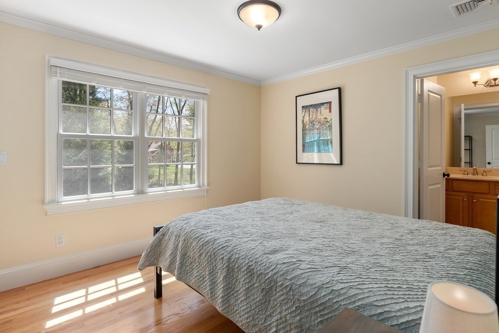 30 Pinecroft Road Weston, MA 02493 - Photo 23 of 38 a bedroom with a bed and a window