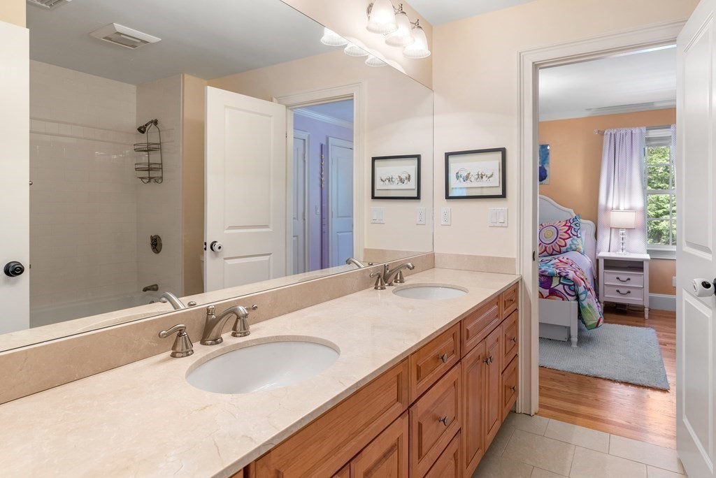 30 Pinecroft Road Weston, MA 02493 - Photo 24 of 38 a bathroom with a granite countertop sink mirror and a