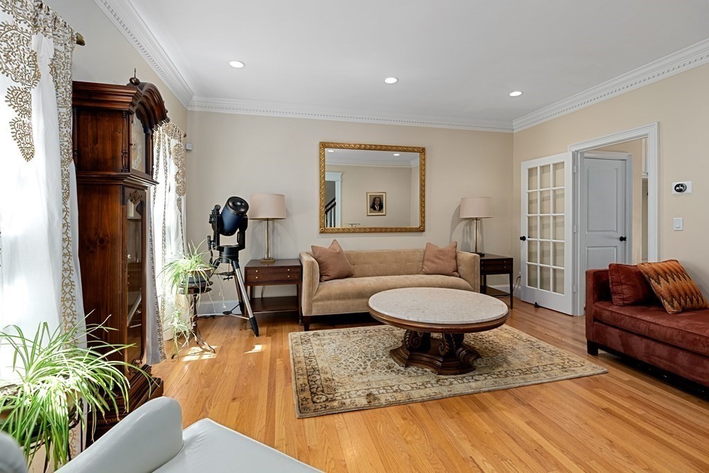 30 Pinecroft Road Weston, MA 02493 - Photo 26 of 38 a living room with furniture and a chair