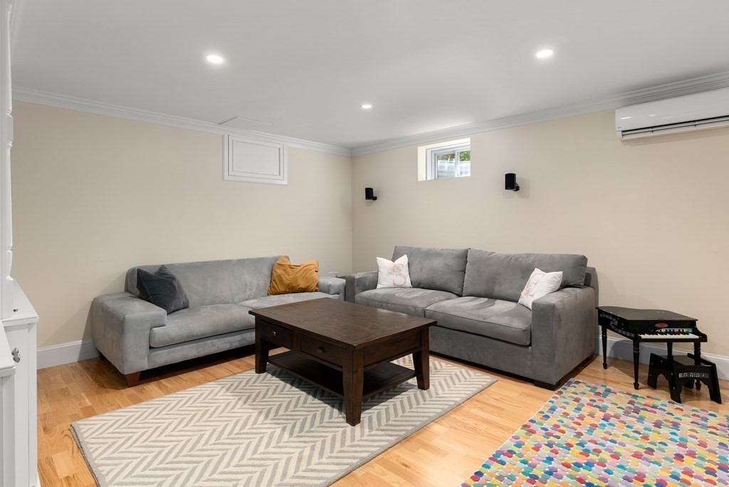 30 Pinecroft Road Weston, MA 02493 - Photo 30 of 38 a living room with furniture and a rug