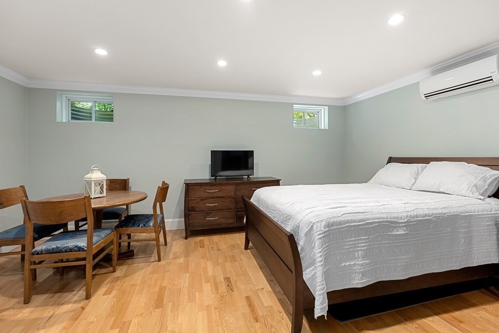 30 Pinecroft Road Weston, MA 02493 - Photo 31 of 38 a bedroom with a bed and a table