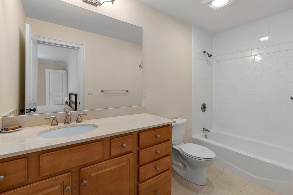 30 Pinecroft Road Weston, MA 02493 - Photo 32 of 38 a bathroom with a sink toilet vanity and shower