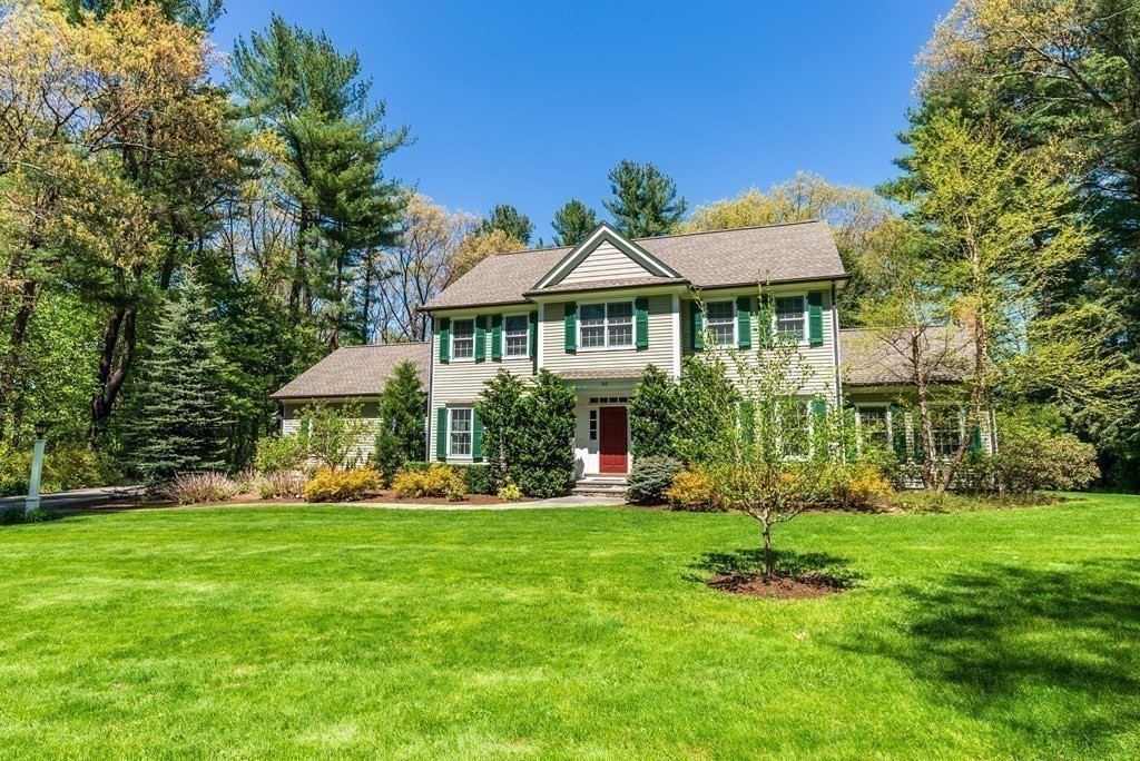 30 Pinecroft Road Weston, MA 02493 - Photo 36 of 38 a front view of a house with a yard table and chairs