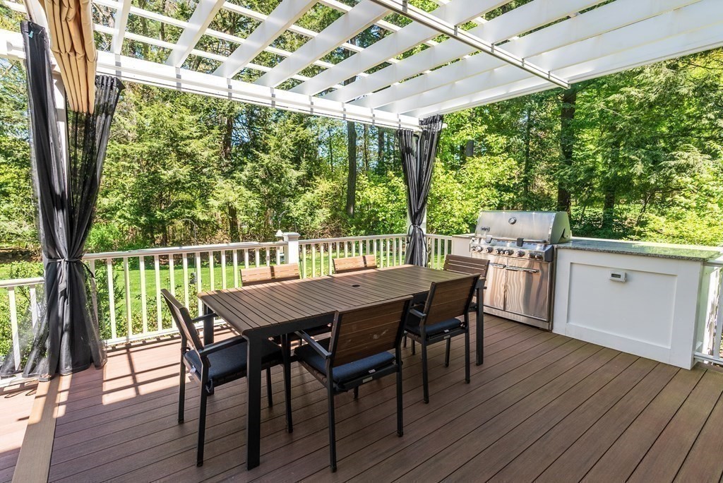 30 Pinecroft Road Weston, MA 02493 - Photo 4 of 38 a view of a patio with a table and chairs