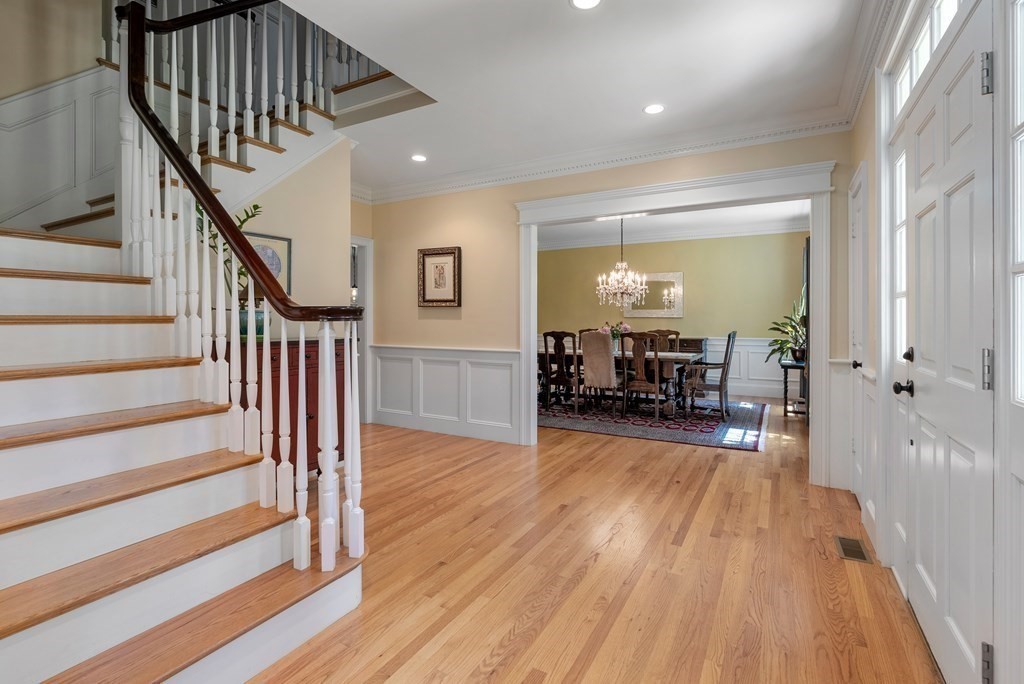 30 Pinecroft Road Weston, MA 02493 - Photo 5 of 38 a view of a room with wooden floor stairs and a livingroom view