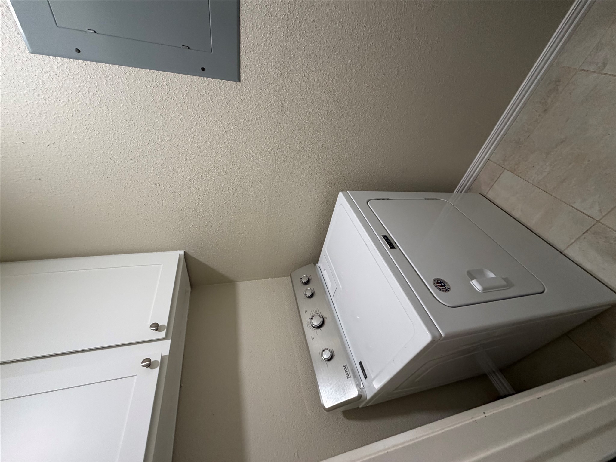 1401 Camp Craft Road, Unit C Austin, TX 78746 - Photo 6 of 12 Efficient laundry space includes contemporary appliances and overhead storage.