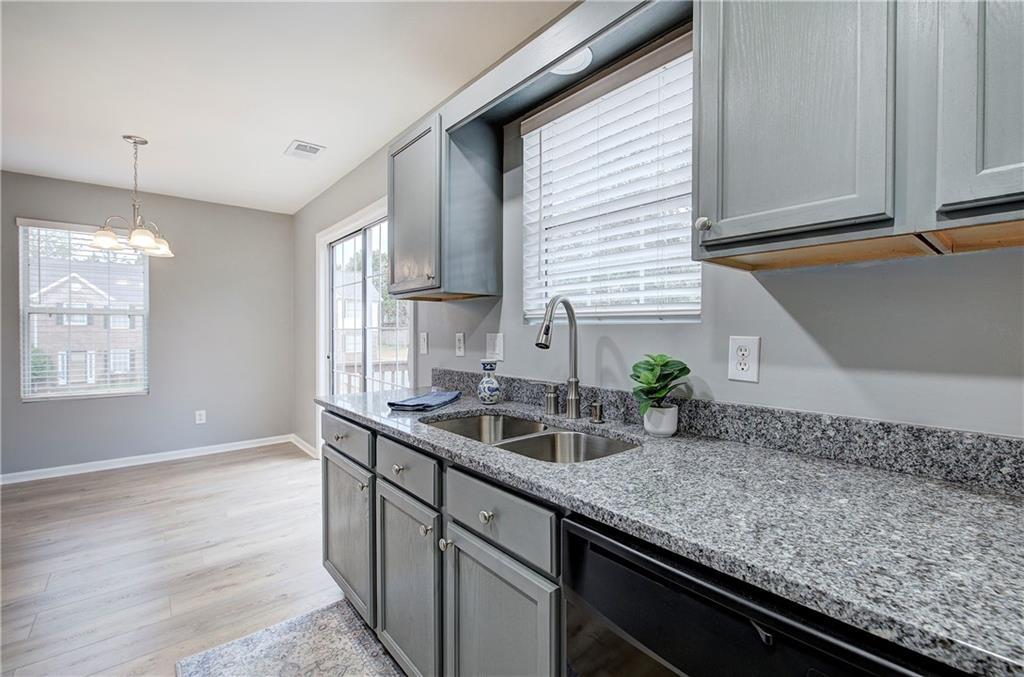 91 Westside Chase Southwest Cartersville, GA 30120 - Photo 12 of 32 a kitchen with a sink and a window