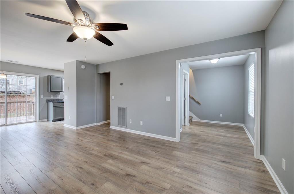 91 Westside Chase Southwest Cartersville, GA 30120 - Photo 13 of 32 wooden floor in an empty room with a window