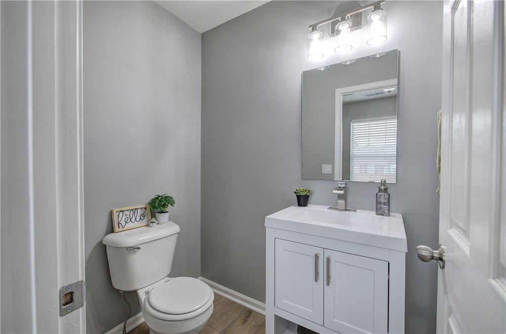 91 Westside Chase Southwest Cartersville, GA 30120 - Photo 18 of 32 a bathroom with a toilet sink and mirror