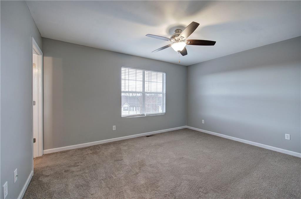 91 Westside Chase Southwest Cartersville, GA 30120 - Photo 20 of 32 an empty room with windows and fan