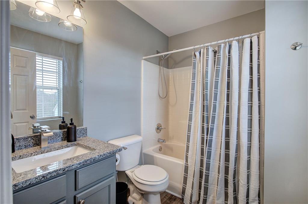 91 Westside Chase Southwest Cartersville, GA 30120 - Photo 22 of 32 a bathroom with a granite countertop sink toilet and shower