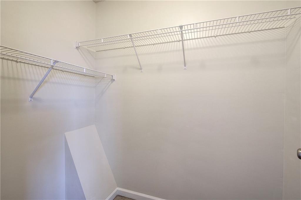 91 Westside Chase Southwest Cartersville, GA 30120 - Photo 23 of 32 a view of a room with racks on the wall