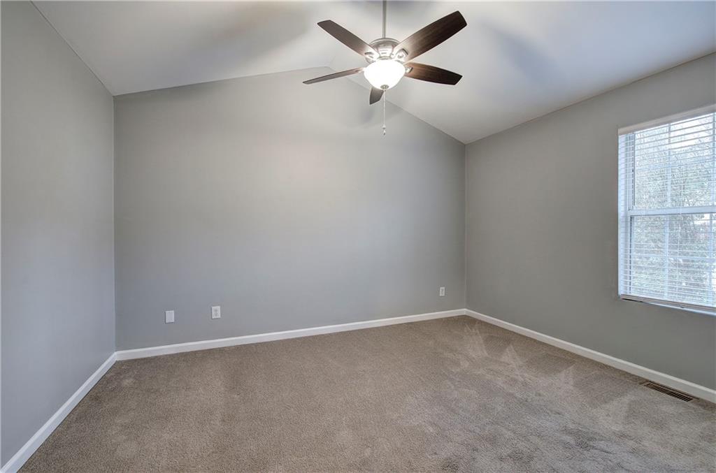 91 Westside Chase Southwest Cartersville, GA 30120 - Photo 24 of 32 an empty room with a window and a fan