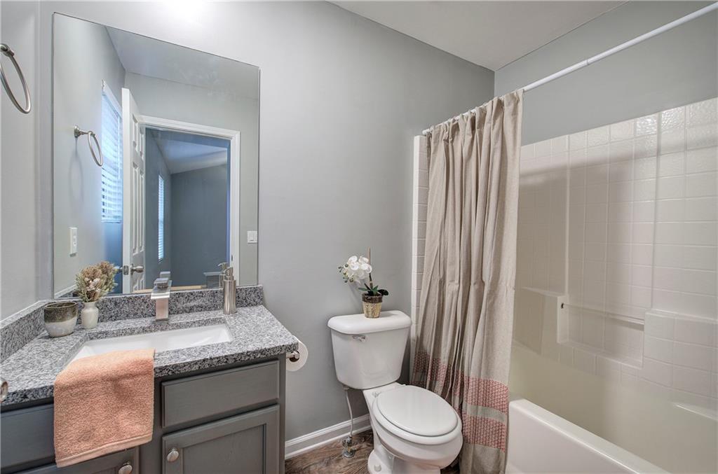 91 Westside Chase Southwest Cartersville, GA 30120 - Photo 26 of 32 a bathroom with a granite countertop sink toilet and shower