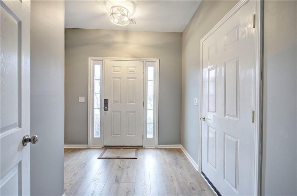 91 Westside Chase Southwest Cartersville, GA 30120 - Photo 5 of 32 a view of a hallway with wooden floor