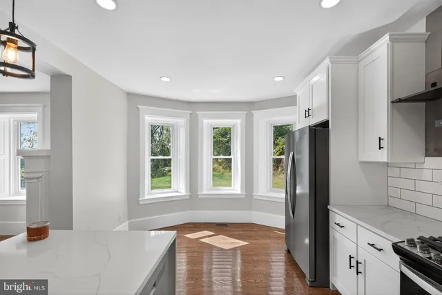 a view of a kitchen cabinets and a window