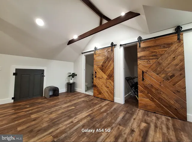 a view of a livingroom with closet and entryway