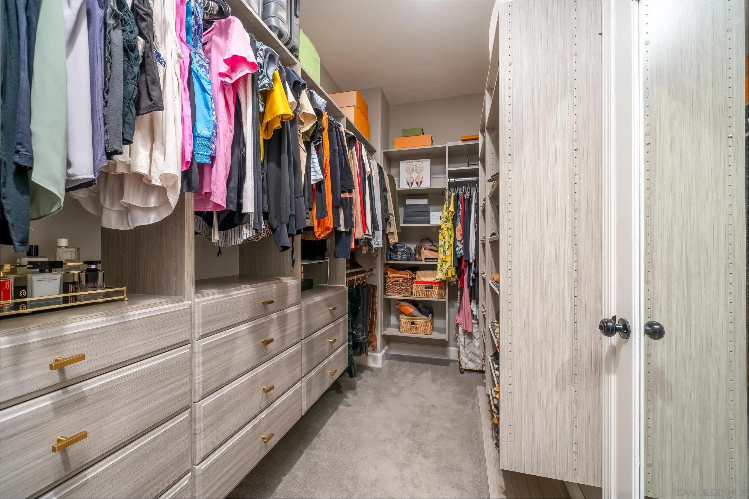 103 Lavender Lake Forest, CA 92630 - Photo 20 of 52 a view of walk in closet with clothes