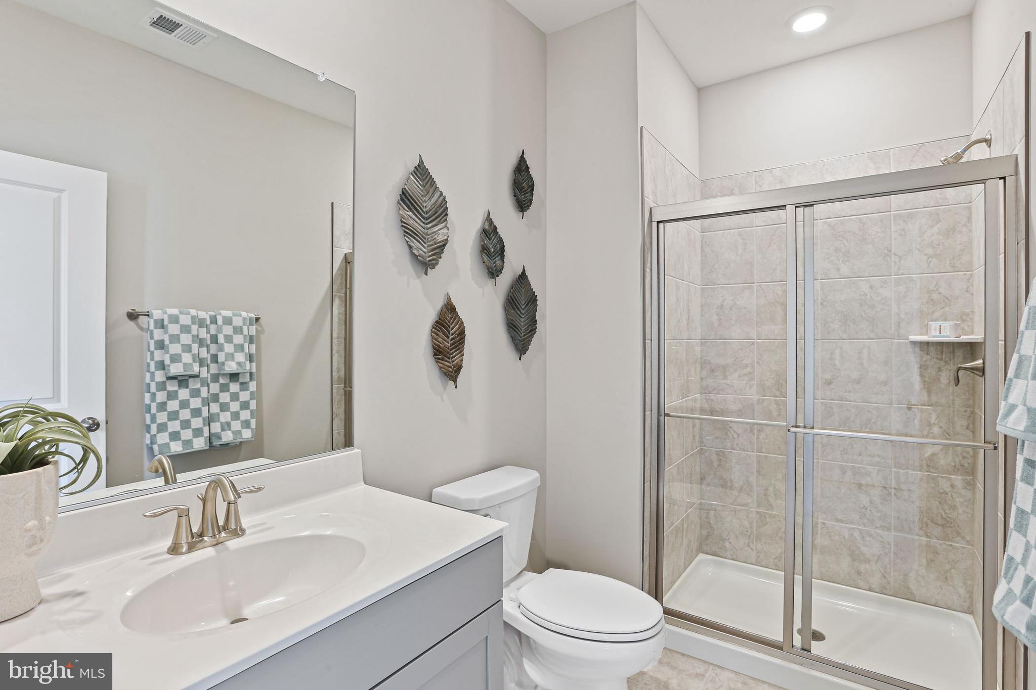 Shenandoah Springs Shenandoah Springs, Unit BRIARS Ranson, WV 25438 - Photo 16 of 23 a bathroom with a sink toilet and shower